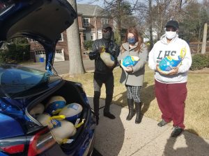 Randy Glover (left) and Reverend Michelle White (far right) received a donation of turkeys from the Foundation's Executive Director, Mary Call Blanusa.