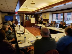 Community leaders listen to Michael Shannon, president of the Northern New Jersey Community Foundation, discuss the launch of the Hackensack River Nation program.