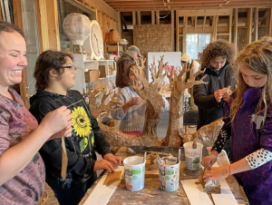 Processional Arts Workshop leads community volunteers in a puppet-making workshop.